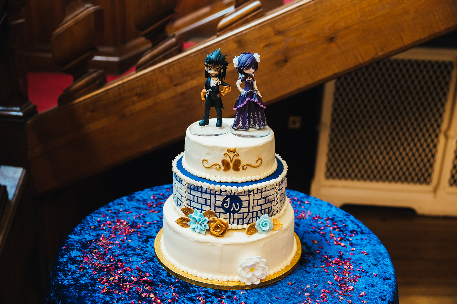 Photo by Kirsty Rockett Photography. Our wedding cake made by our friend Nell! Complete with a blue velvet table cloth, and with the lattice inspiration in the second tier.